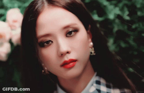A Close Up Of A Woman 'S Face With Red Lipstick GIF