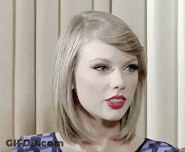 A Close Up Of A Woman 'S Face With Red Lipstick . GIF