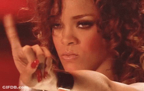 A Close Up Of A Woman 'S Face With Red Nails Holding A Piece Of Paper . GIF