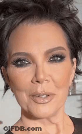 A Close Up Of A Woman 'S Face With Short Hair And A Very Serious Look On Her Face . GIF