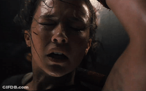 A Close Up Of A Woman 'S Face With Sweat On Her Forehead GIF