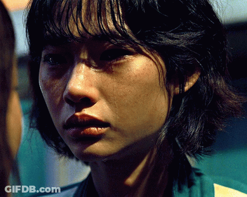 A Close Up Of A Woman 'S Face With Tears Coming Out Of Her Eyes GIF