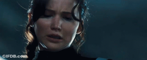A Close Up Of A Woman 'S Face With Tears Coming Out Of Her Eyes GIF