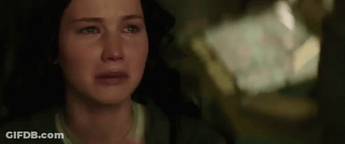 A Close Up Of A Woman 'S Face With Tears Running Down Her Cheeks . GIF