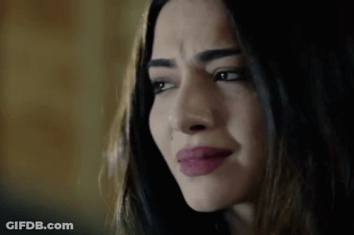 A Close Up Of A Woman 'S Face With Tears Running Down Her Face . GIF