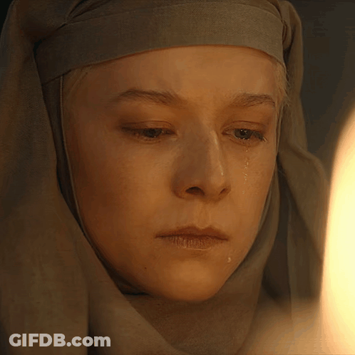 A Close Up Of A Woman 'S Face With Tears Running Down Her Face GIF