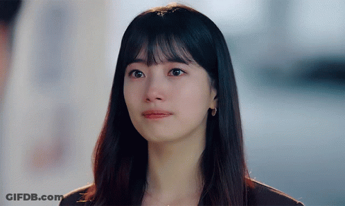 A Close Up Of A Woman 'S Face With Tears Running Down Her Face GIF