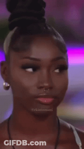 A Close Up Of A Woman 'S Face With The Hashtag Ekintsunami On The Bottom GIF