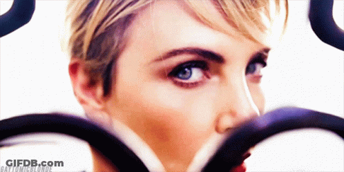 A Close Up Of A Woman 'S Face With The Hashtag Gaytonicblonde GIF