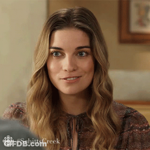 Close Up Of Woman's Face With Schitts Creek Hashtag GIF
