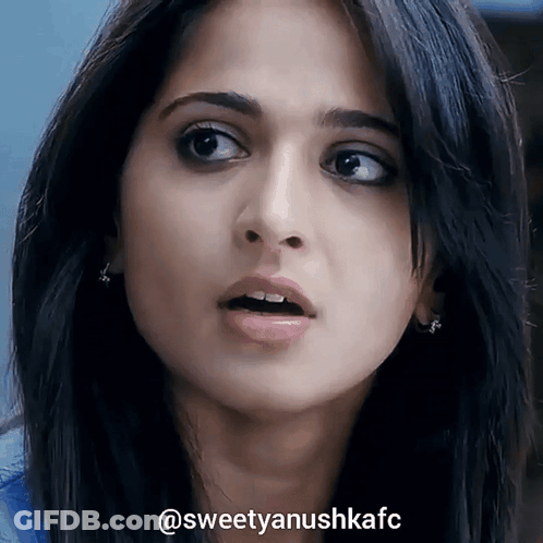 A Close Up Of A Woman 'S Face With The Hashtag Sweetyanushkafc On The Bottom GIF