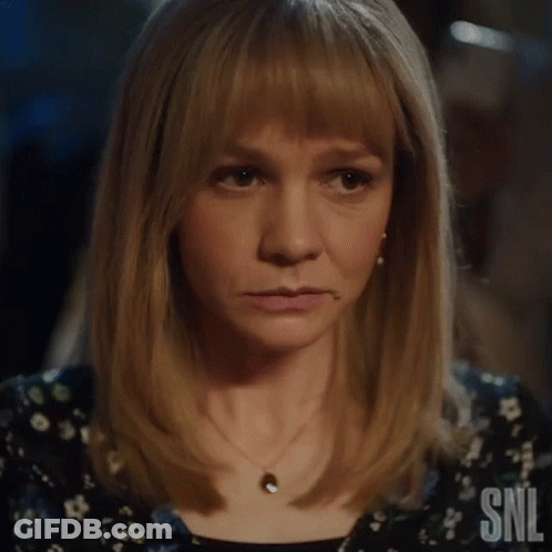 A Close Up Of A Woman 'S Face With The Letters Snl Visible GIF