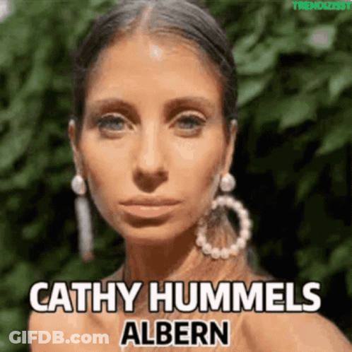A Close Up Of A Woman 'S Face With The Name Cathy Hummels Albern Above Her GIF