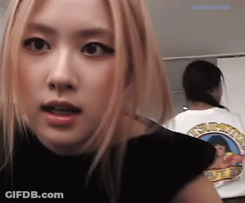A Close Up Of A Woman 'S Face With The Name Rosiesarcade Written On The Bottom GIF