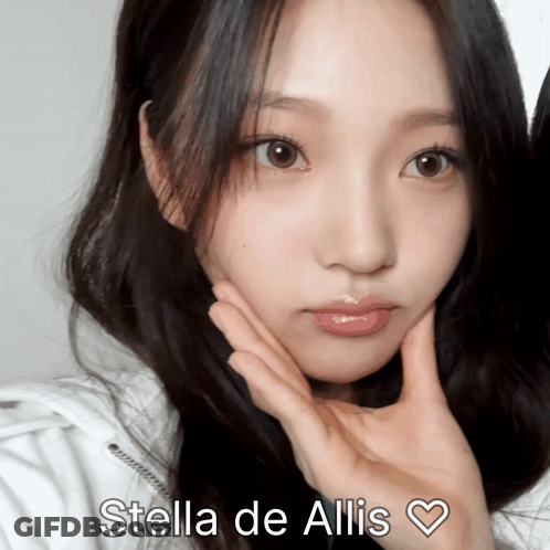 A Close Up Of A Woman 'S Face With The Name Stella De Allis Written Above Her GIF