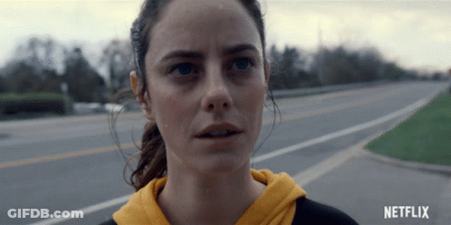 A Close Up Of A Woman 'S Face With The Netflix Logo In The Corner GIF