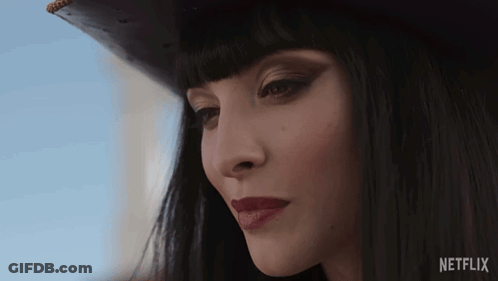 A Close Up Of A Woman 'S Face With The Netflix Logo Visible GIF