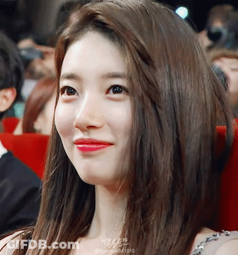 A Close Up Of A Woman 'S Face With The Number 41010 On The Bottom GIF