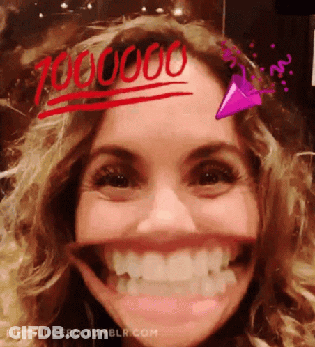 A Close Up Of A Woman 'S Face With The Number 700000 Written On Her Forehead .. GIF