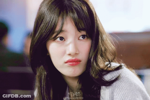 A Close Up Of A Woman 'S Face With The Number 94 1010 On The Bottom GIF