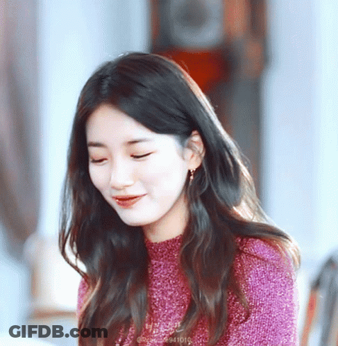 A Close Up Of A Woman 'S Face With The Number 941010 On The Bottom Left GIF