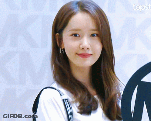 A Close Up Of A Woman 'S Face With The Topst Logo In The Corner GIF