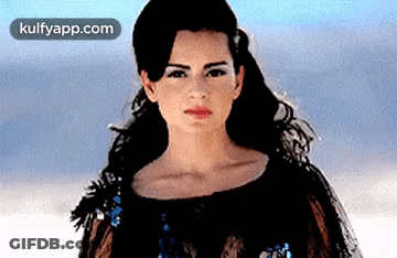 A Close Up Of A Woman 'S Face With The Website Kulfyapp.com In The Corner . GIF