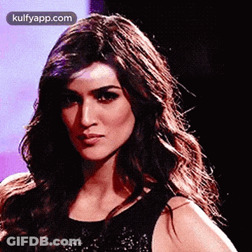 A Close Up Of A Woman 'S Face With The Website Kulfyapp.com In The Corner . GIF