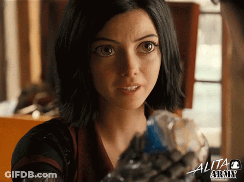 A Close Up Of A Woman 'S Face With The Word Alita Above Her GIF