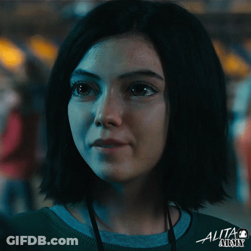 A Close Up Of A Woman 'S Face With The Word Alita Army On The Bottom Right GIF