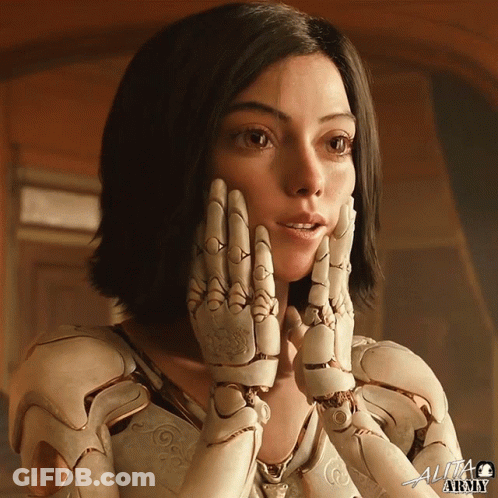 A Close Up Of A Woman 'S Face With The Word Alita At The Top GIF