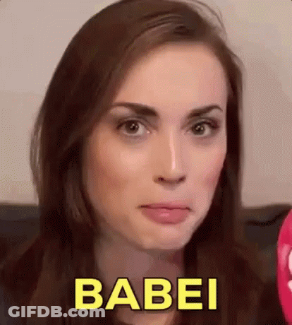 A Close Up Of A Woman 'S Face With The Word Babei In Yellow Letters . GIF
