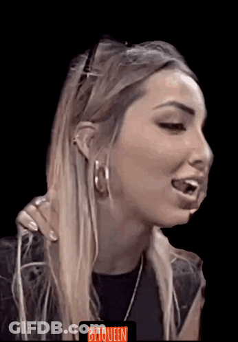 A Close Up Of A Woman 'S Face With The Word Bitqueen On The Bottom Left GIF