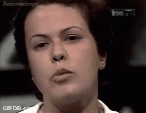 A Close Up Of A Woman 'S Face With The Word Bravo In The Upper Right Corner GIF