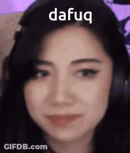 A Close Up Of A Woman 'S Face With The Word Dafug Written On Her Forehead . GIF