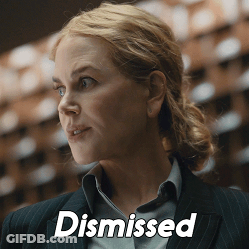 A Close Up Of A Woman 'S Face With The Word Dismissed Above Her GIF