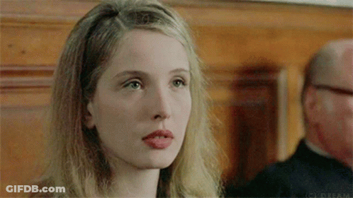 A Close Up Of A Woman 'S Face With The Word Dream On The Bottom Left GIF