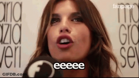 A Close Up Of A Woman 'S Face With The Word Eeeee Written On It . GIF