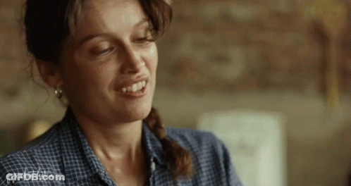 A Close Up Of A Woman 'S Face With The Word Freedom Visible GIF