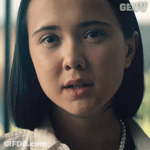 A Close Up Of A Woman 'S Face With The Word Genw On The Bottom Right GIF