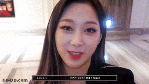 A Close Up Of A Woman 'S Face With The Word Giselle On The Bottom GIF