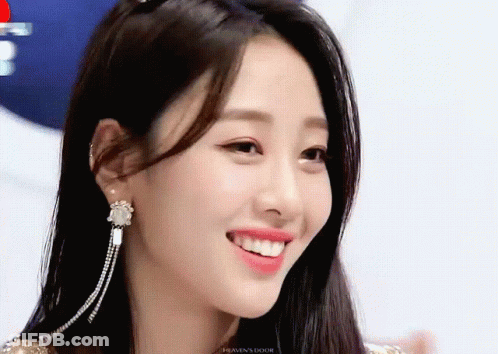 A Close Up Of A Woman 'S Face With The Word Heaven 'S Door On The Bottom GIF