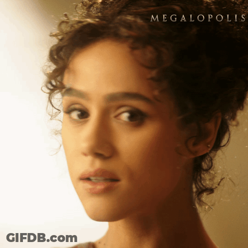 A Close Up Of A Woman 'S Face With The Word Megalopolis On The Bottom Right GIF