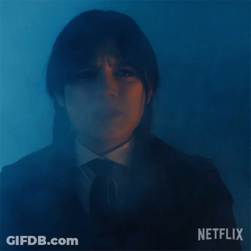A Close Up Of A Woman 'S Face With The Word Netflix On The Bottom GIF