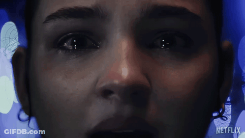 A Close Up Of A Woman 'S Face With The Word Netflix On The Bottom Right GIF