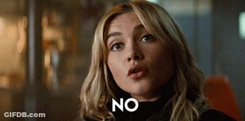 A Close Up Of A Woman 'S Face With The Word No In White Letters GIF