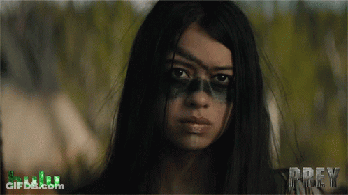 A Close Up Of A Woman 'S Face With The Word Prey In The Corner GIF