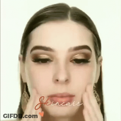 A Close Up Of A Woman 'S Face With The Word Skincare Written In The Corner . GIF