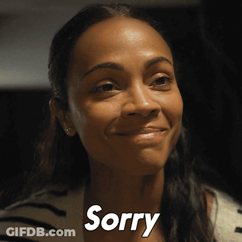 A Close Up Of A Woman 'S Face With The Word Sorry In White Letters GIF