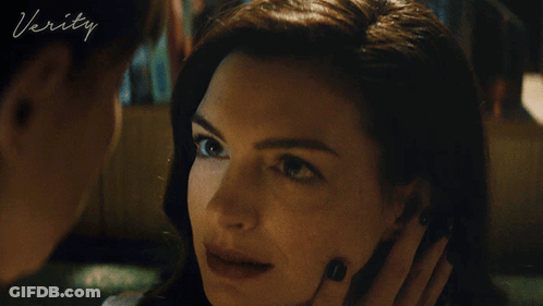 A Close Up Of A Woman 'S Face With The Word Verity On The Bottom Left GIF